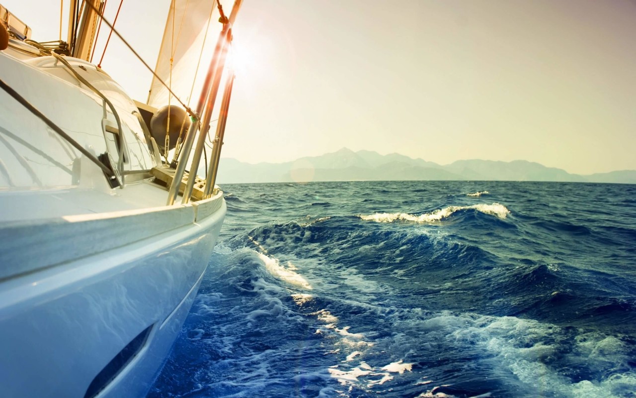 Yacht Sailing Downwind at Sunset Wallpaper for Desktop 1280x800